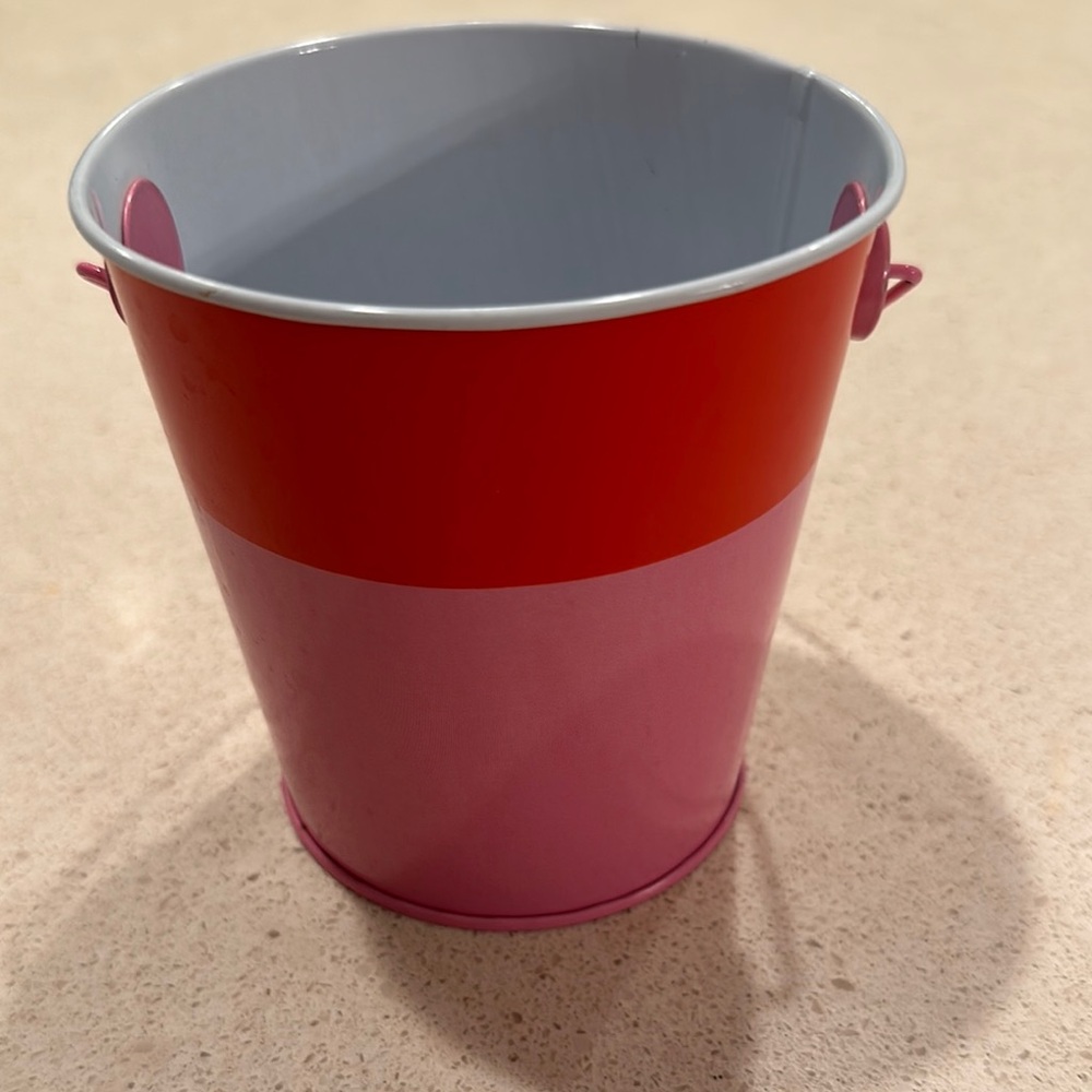 Red and Pink Metal Bucket